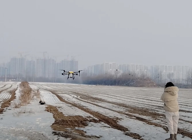Joyance JT20L-404 agricultural JT20L-404 fumigation drone with centrifugal nozzles and fertilizer spreader flight test in snow field